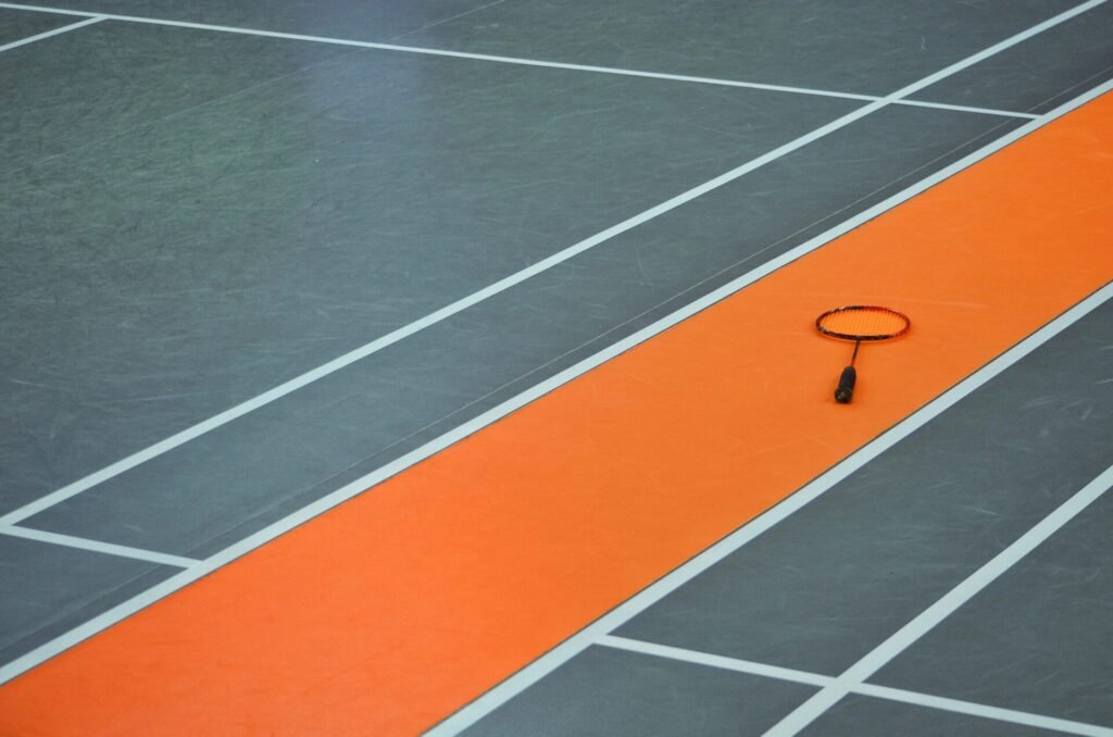 high angle view badminton racket floor
