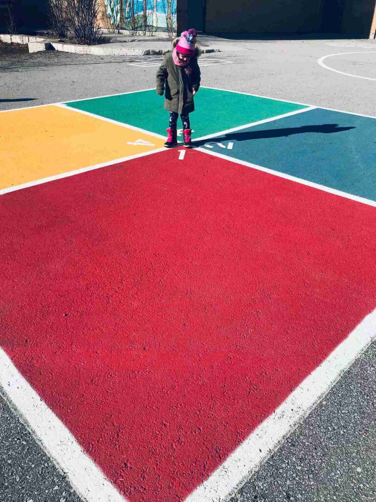 rear view child standing up playing with colors shapes 11zon