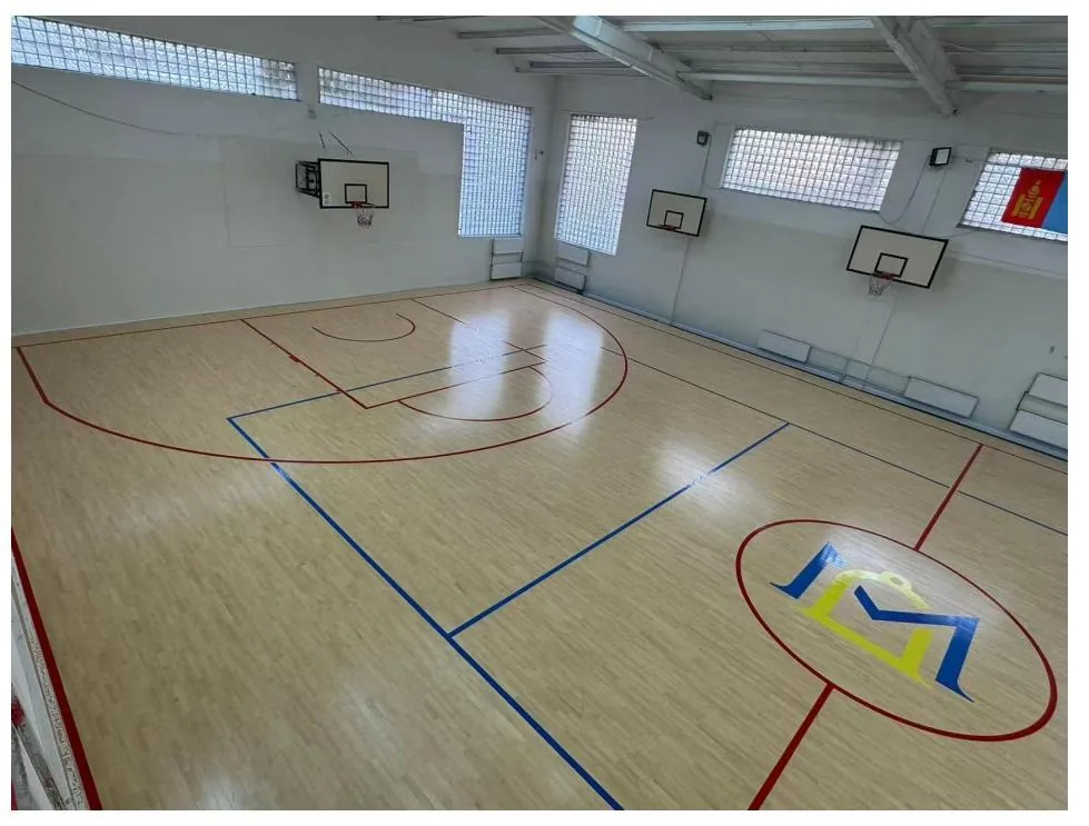 Indoor basketball training court with a wood sports floor