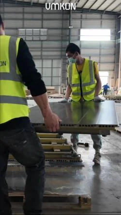 Crew handling Macwood modular panels